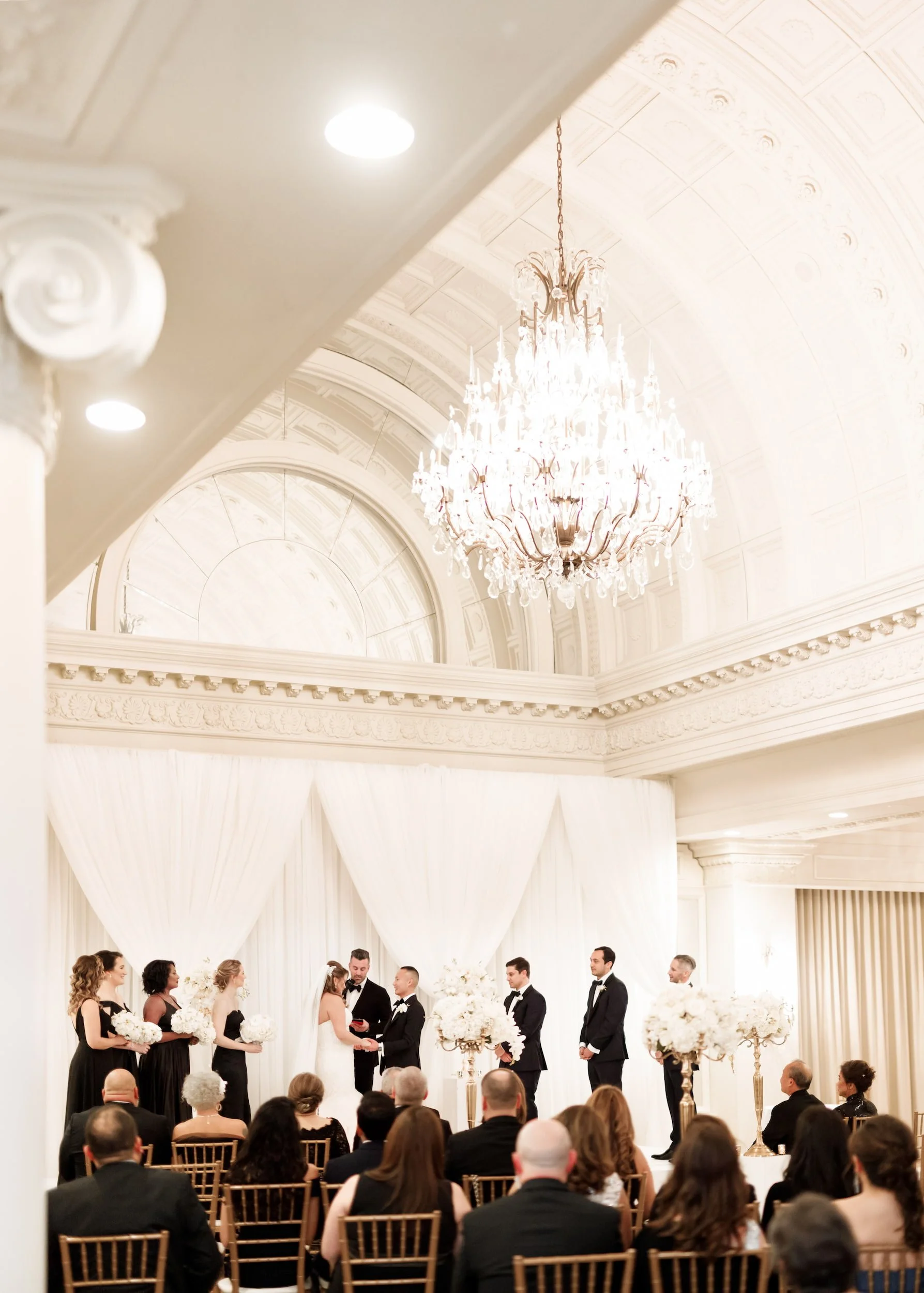 Wedding ceremony inside the Vanity Fair Ballroom at Omni King Edward Hotel in Toronto