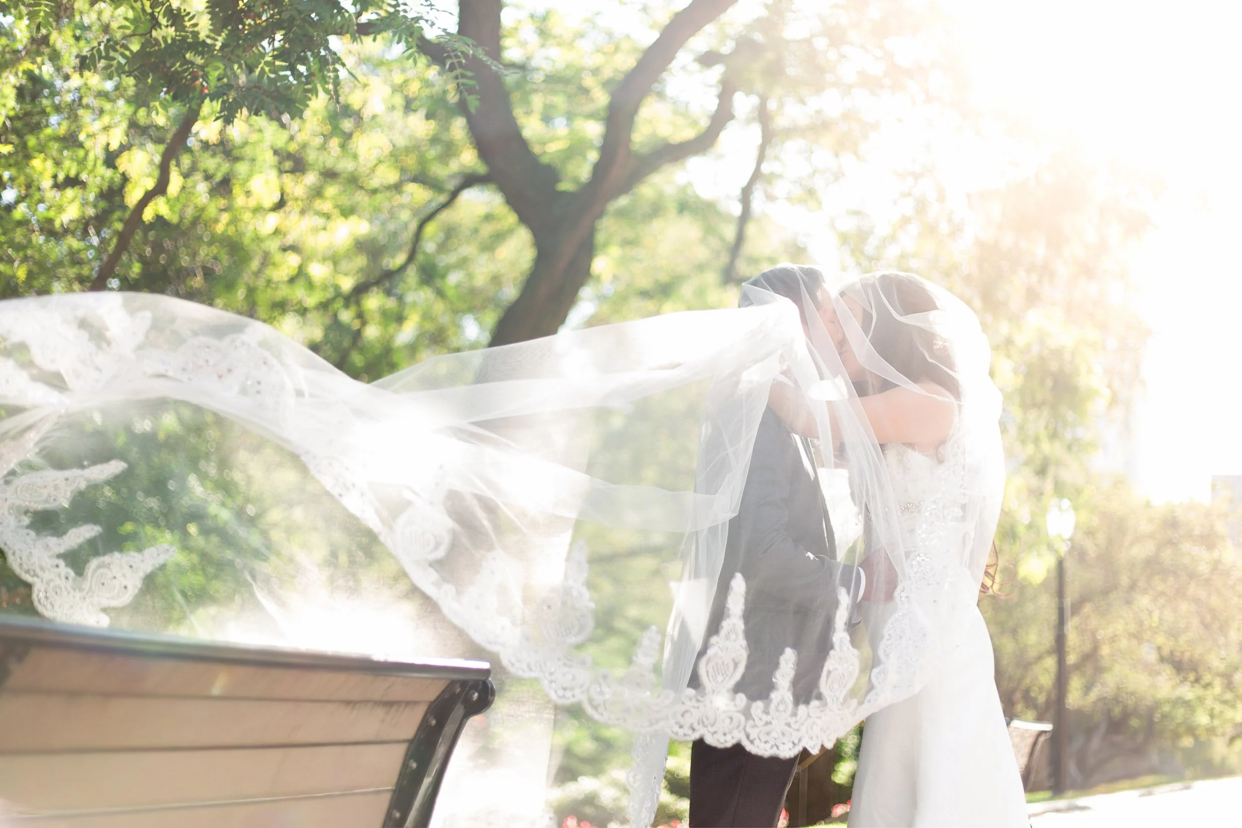 Romantic veil moment in garden courtyard at Osgoode Hall courthouse in Toronto
