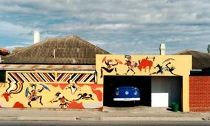 Australia This mural was commissioned in 1988, Australia’s bicentennial year, by Dr.Marin Hartmann. The site was the Hartmann residence on Henley Beach Rd., Adelaide. It was painted using the traditional colours of the Aborigine people and thematically highlighted their 200 year cultural dilemma.