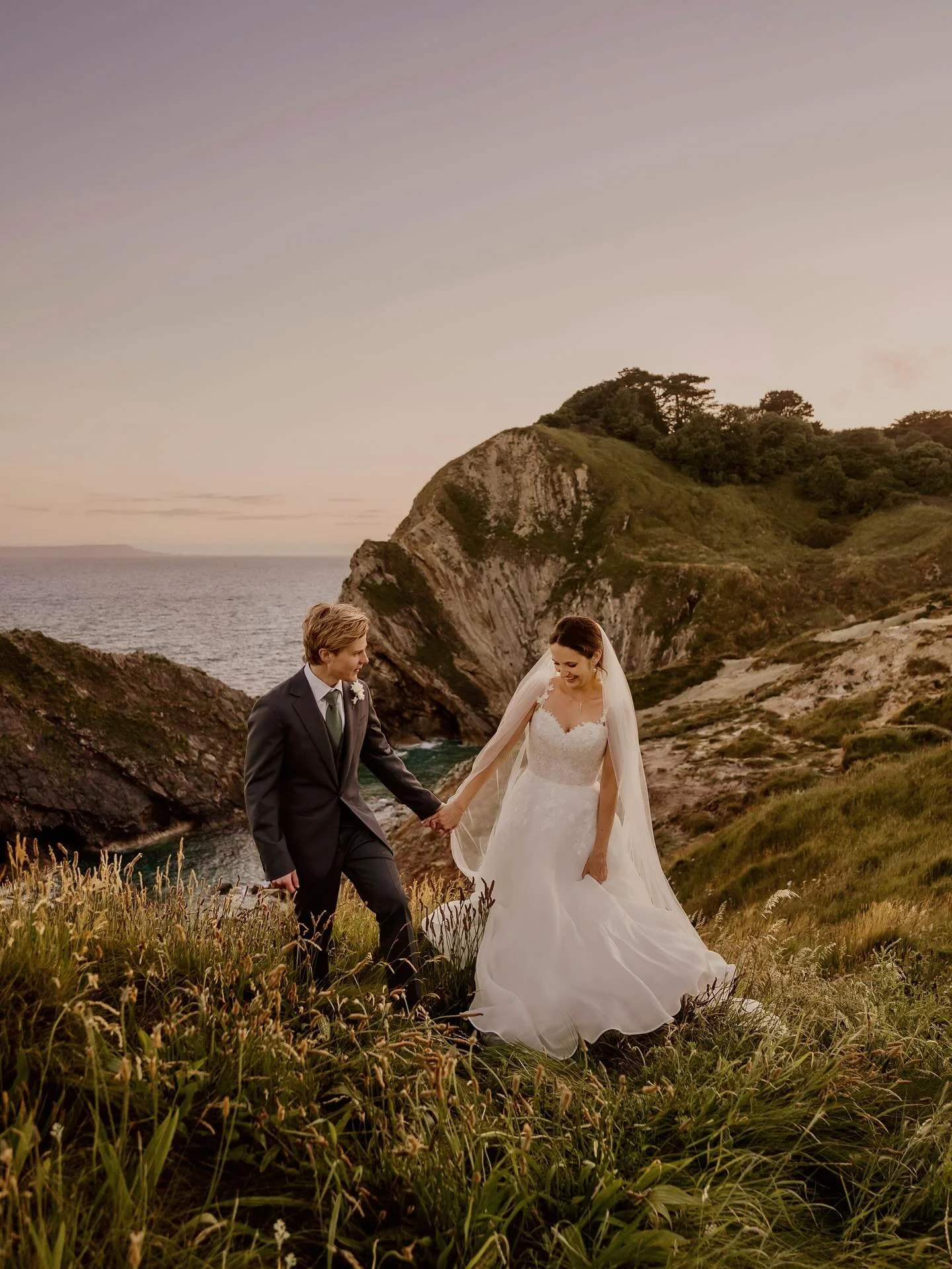Gorgeous Charlie and Oli! These two (insert giant heart hands here 🫶🏼) well you can see how happy they are, Charlie was literally beaming on her special day! Such a joy to be back at one of my faves @lulworthweddings for this one and we had such a 