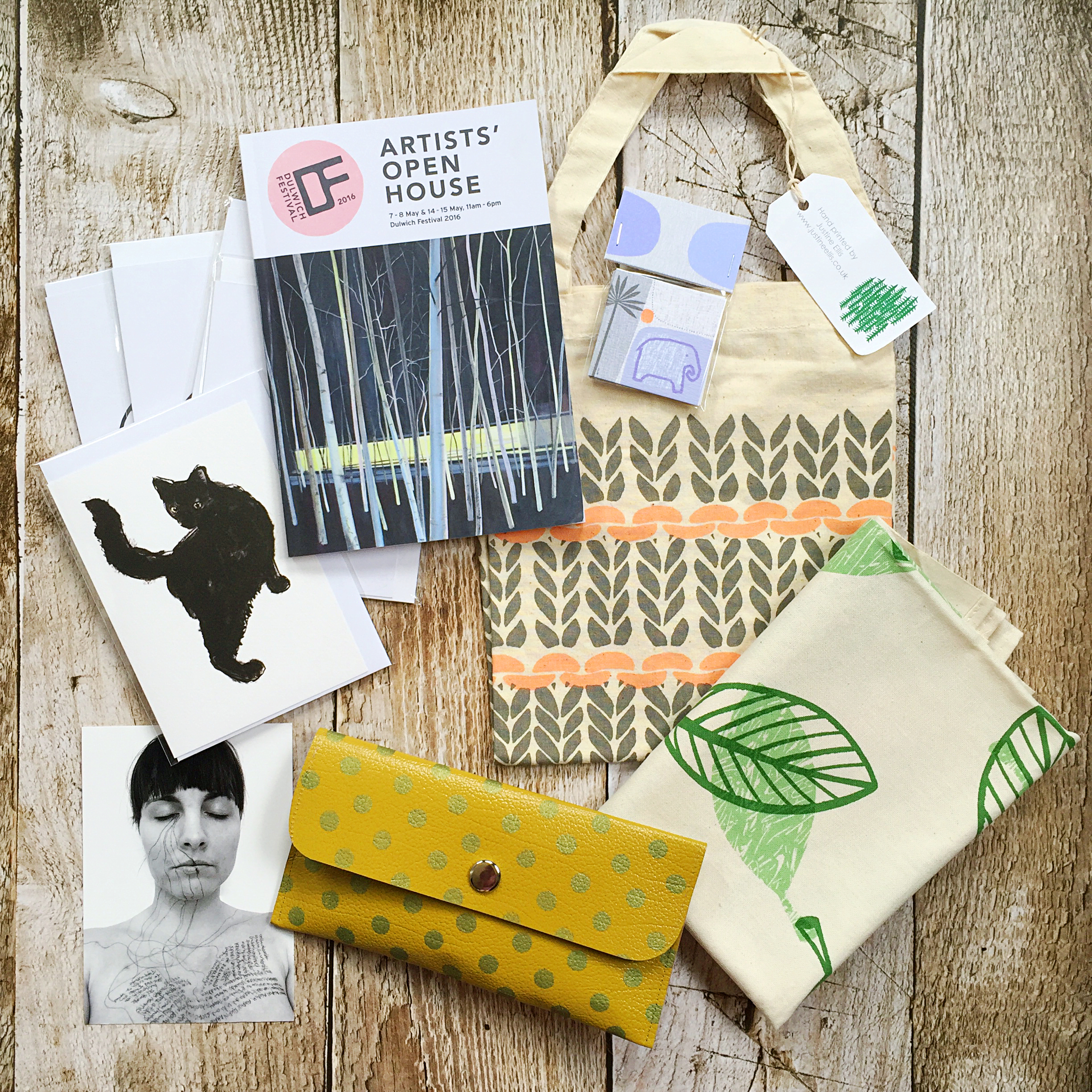 From top right: Tote bag and tea towel - Justine Ellis, mini cards (on the bag) - Sarah Hamilton, yellow spotty purse - Anna Jackson, postcard - Liz Atkin, cat greetings card - Tiff Howick