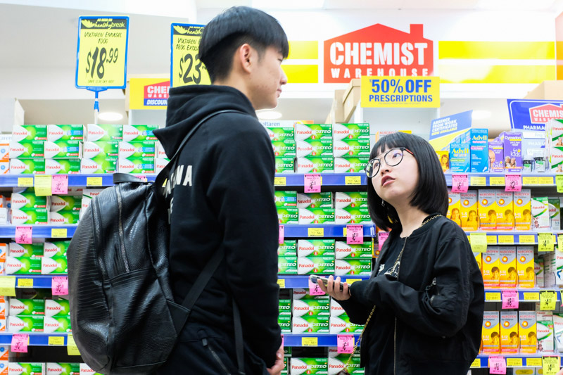 Customers at the Chemist Warehouse stand in front of the paracetamol isle. Being a daigou is a popular part time occupation for international students from China due to both convenience and the potential to earn good money whilst easing the financial burden on their parents back home. Asanka Brendon Ratnayake for The New York Times