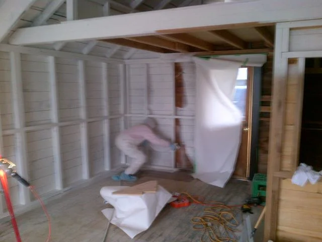 Spraying a boathouse
