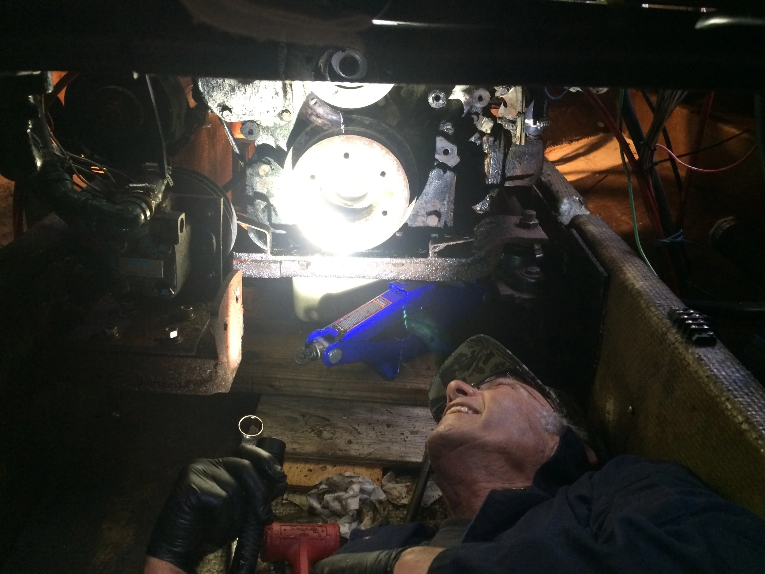 Don assessing the front crankshaft seal removal in our (thankfully) dry bilge