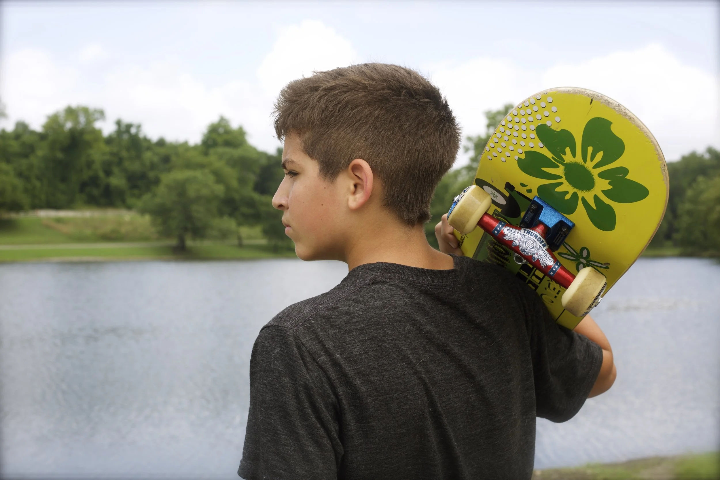 Gideon next to lake w: skateboard.jpg