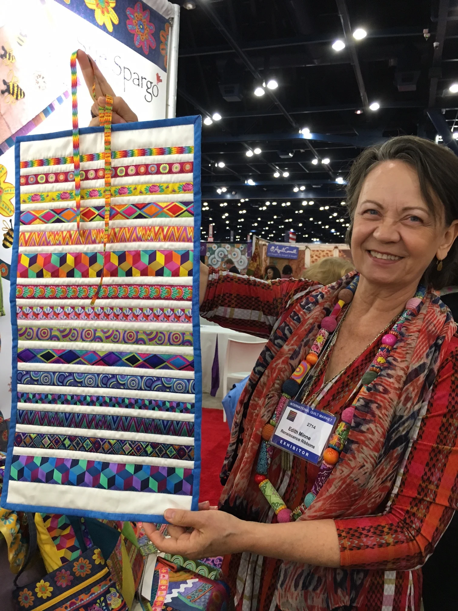 Edith Minne of Renaissance Ribbons displays her Kaffe Fassett Collective ribbons.
