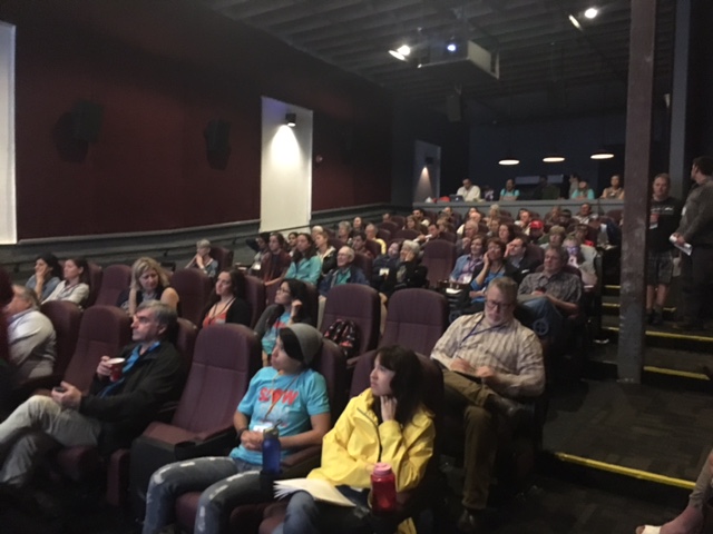 Slow Fish attendees preparing to watch a film at the Broad Theater.