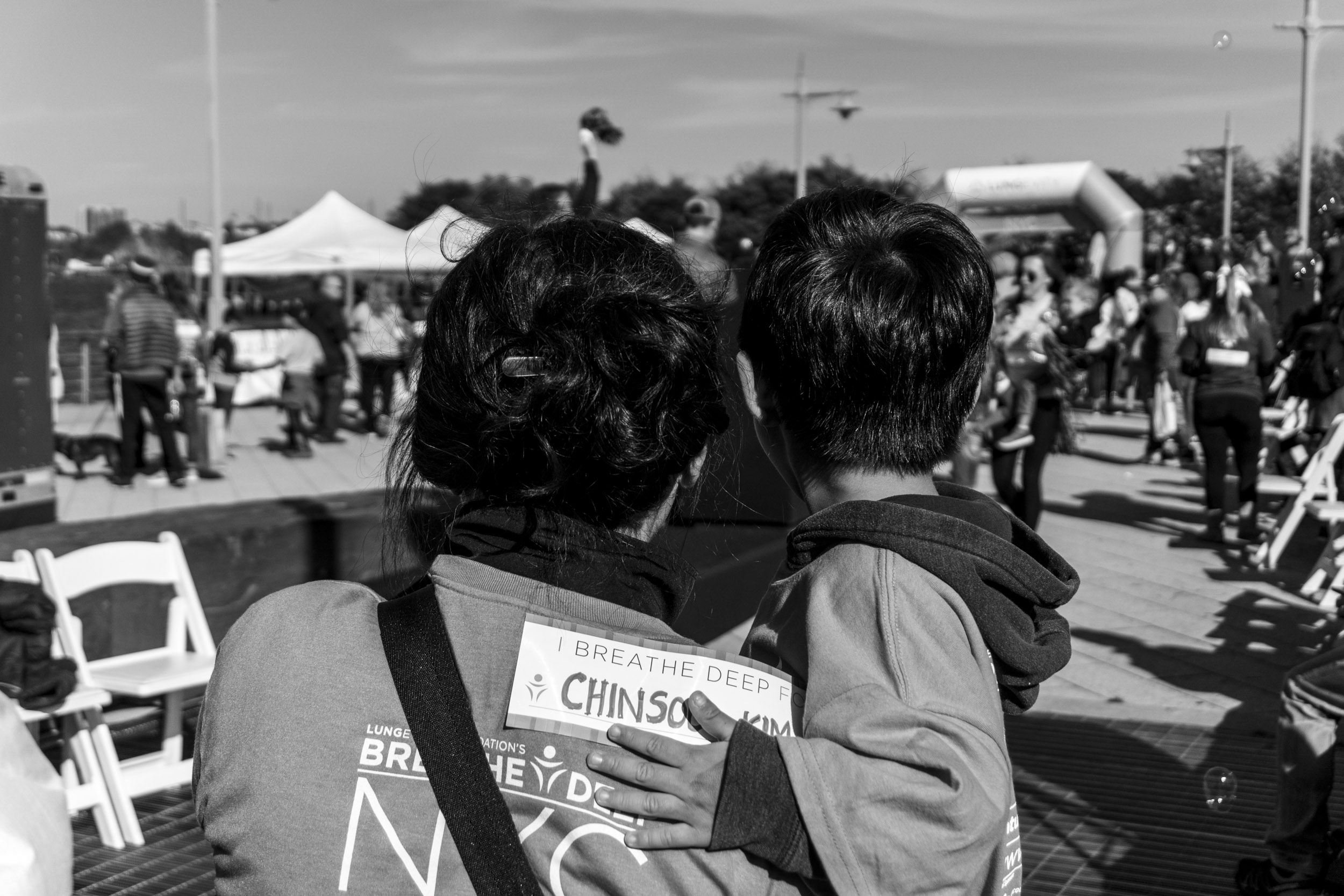 Miwha Kim and Mason Cho at a fund raiser event for lung cancer research in memory of Chinsoo Kim, the late husband and grandfather, who died on 9/14/17 after a yearlong battle with lung cancer. October 28, 2017. Hudson River Park, Pier 63, New York, NY. Photo by Sung Cho.