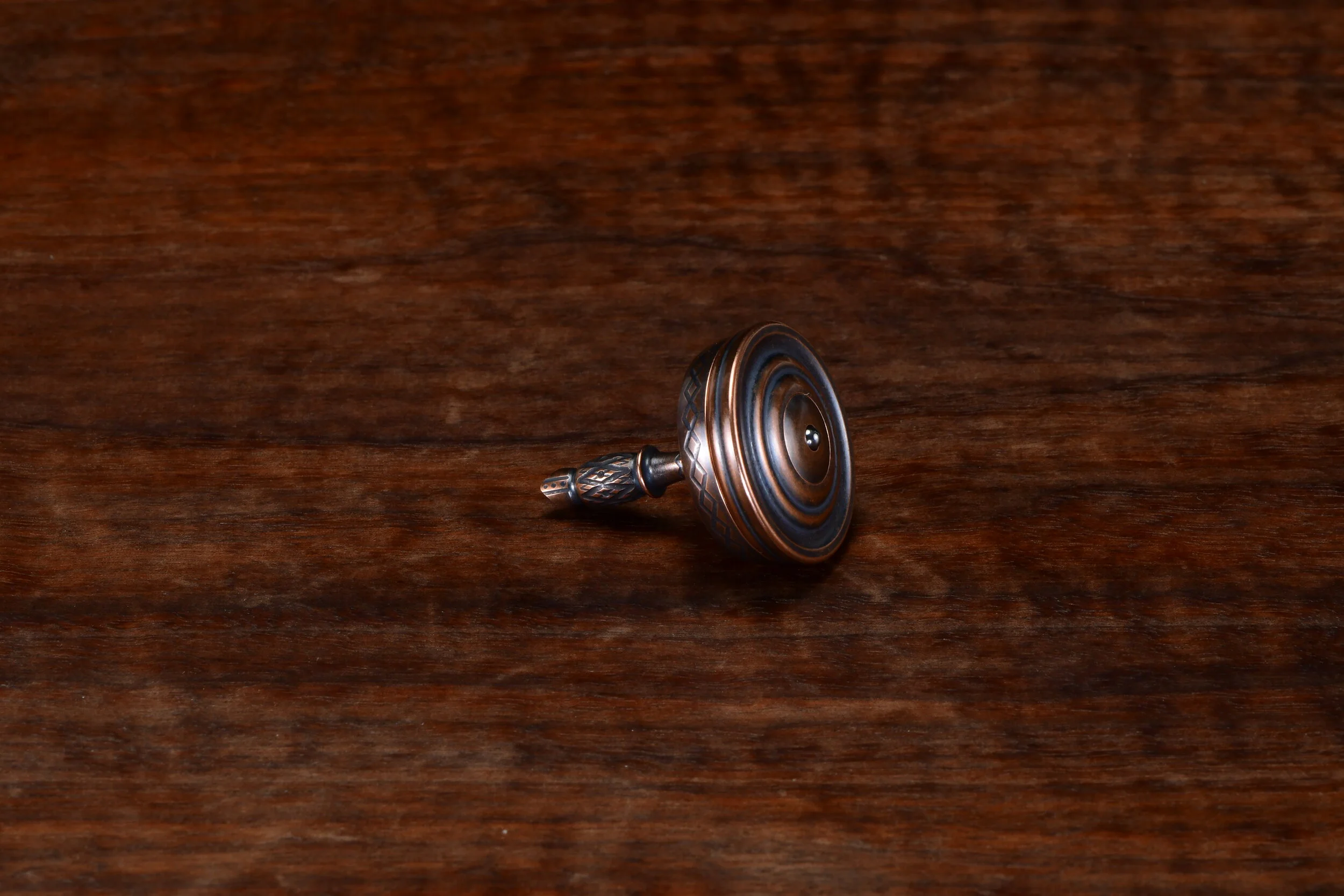 Bottom View of Antiqued Copper Bishop Spinning Top