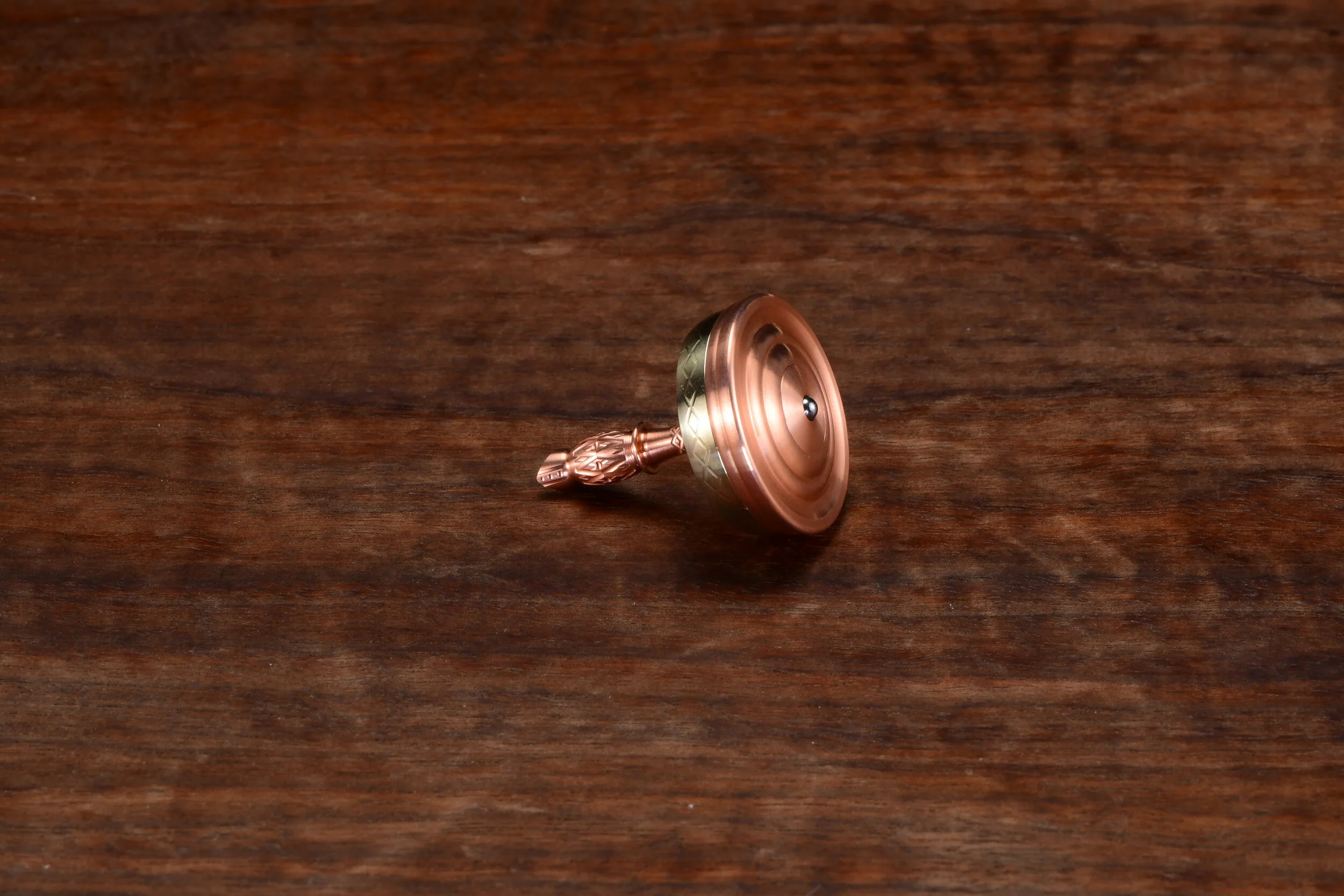 Bottom View of Copper/Bronze Bishop Spinning Top