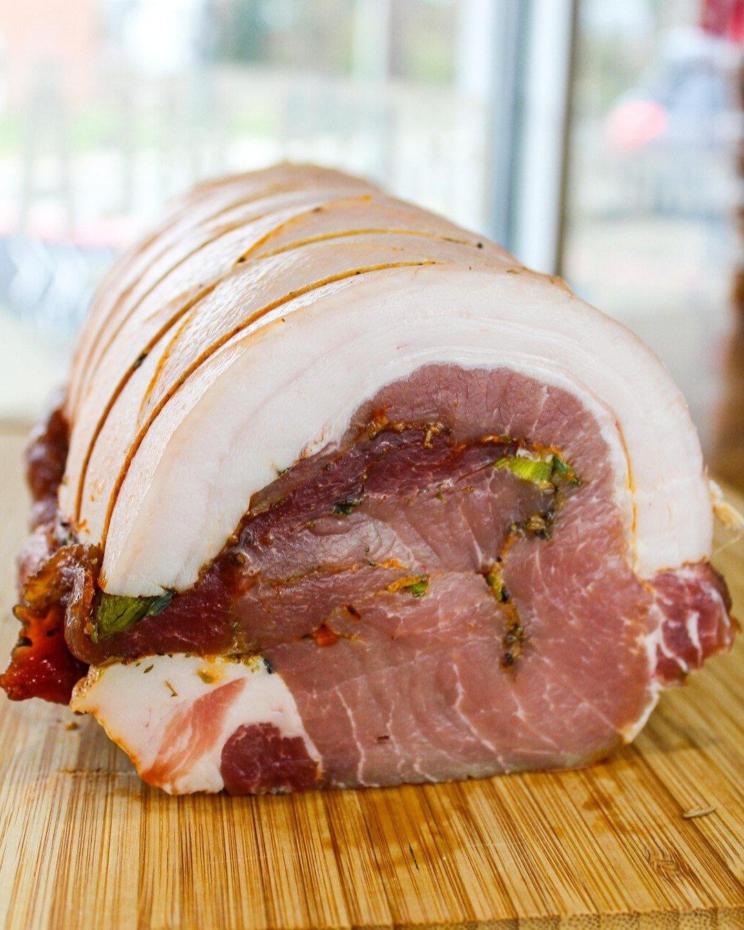 Our porchetta is perfect for your holiday table.

Our butcher butterflies a pork belly, seasons it with garlic, salt, pepper, citrus zest, fennel and rosemary, then wraps and ties it around a butterflied pork loin. This process is elaborate but resul