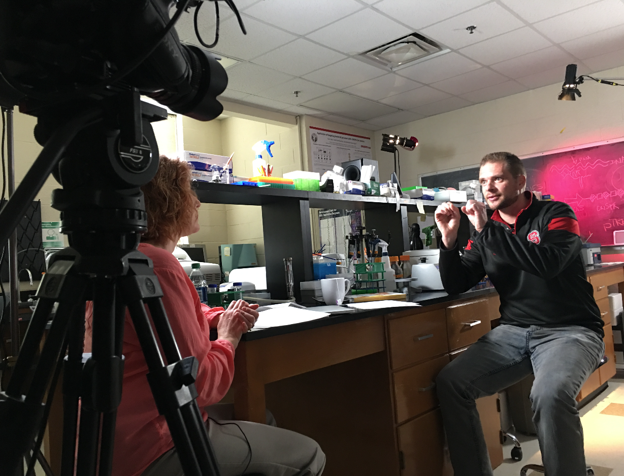 Dr. Barrangou explains a complicated idea during Lynne's interview at the lab.