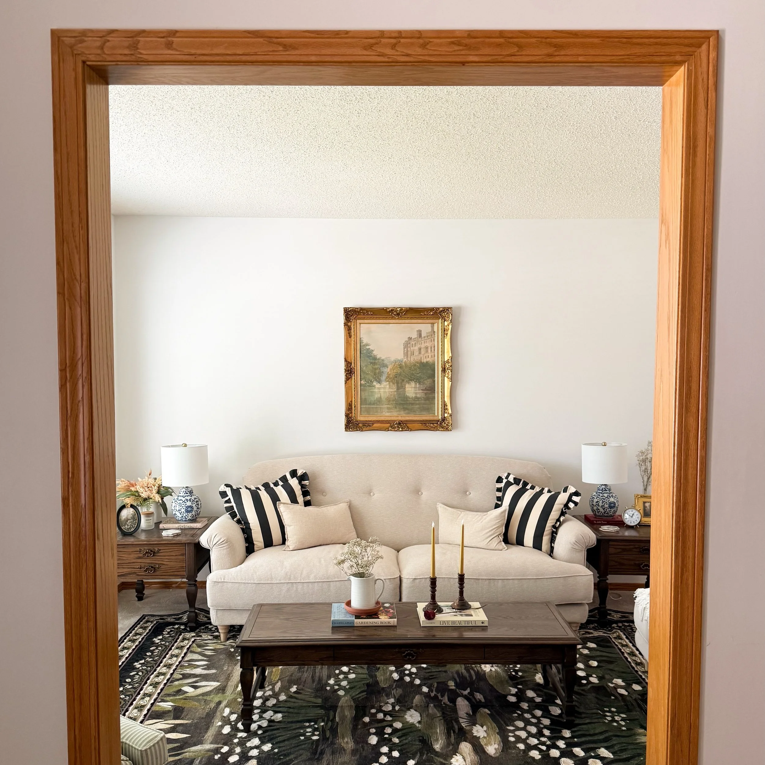 🕯️ Living Room Transformation 📚

Swipe to see the before from back in November ➡️

I wanted to create a space that was warm, comfortable but also whimsical. After securing that vintage gold frame on marketplace my vision slowly started coming to li