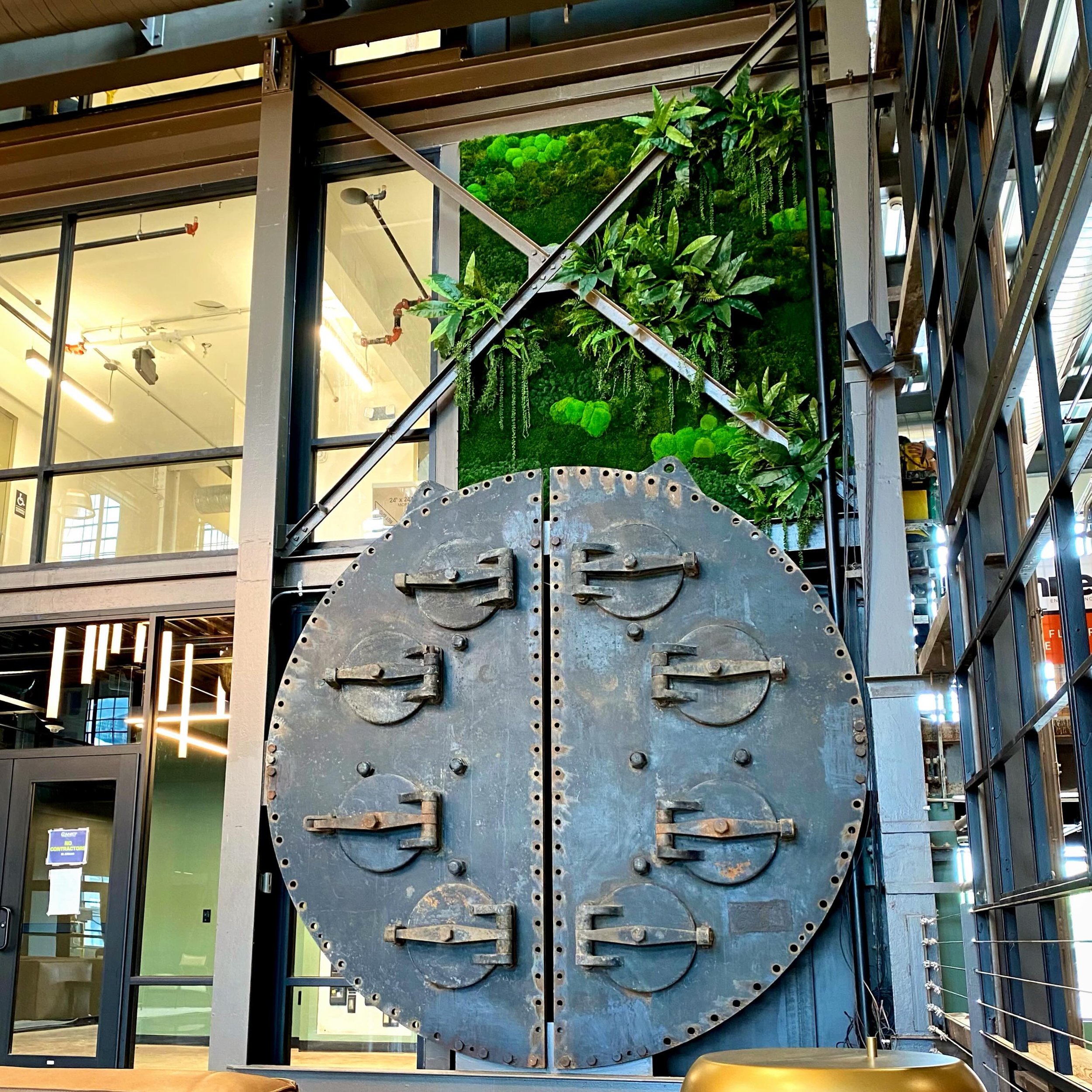 Steel, structure, and a little unexpected greenery. Some contrasts just work. Proof that a little green can go a long way. 🌿

#interiorplantdesign #greenwall #mosswall #commercialinteriordesign