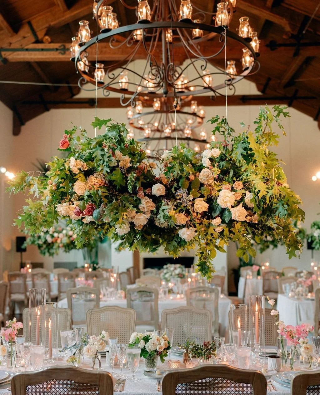 Dreamy &amp; romantic from every angle ✨⁠
⁠
Delicate floral clouds floated above the long tables, lush centerpieces graced the rounds, and the head table bloomed with a garden-inspired meadow runner &mdash; a room transformed into a gentle, living la