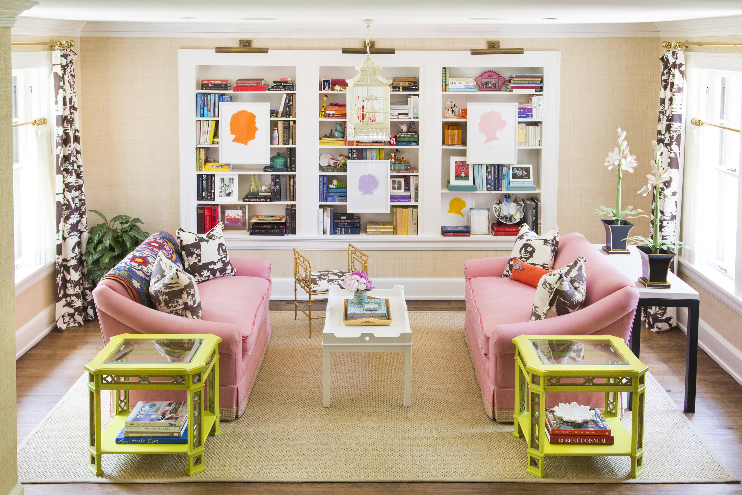  colorful sitting area with bright pink couches 