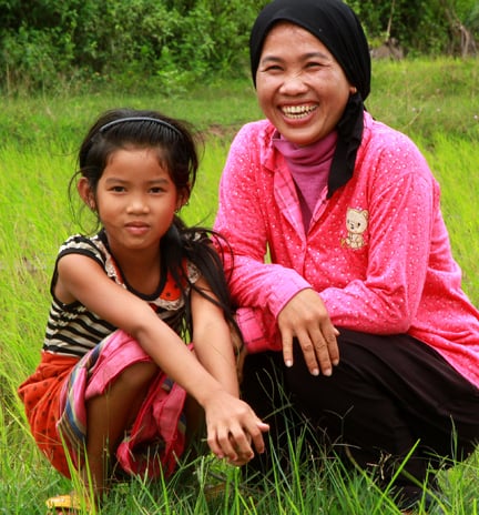 CAPTION: Sun Ley and her daughter in the rice fields surrounding the village of Tramung Chrum in Kampong Chhnang Province, rural Cambodia.