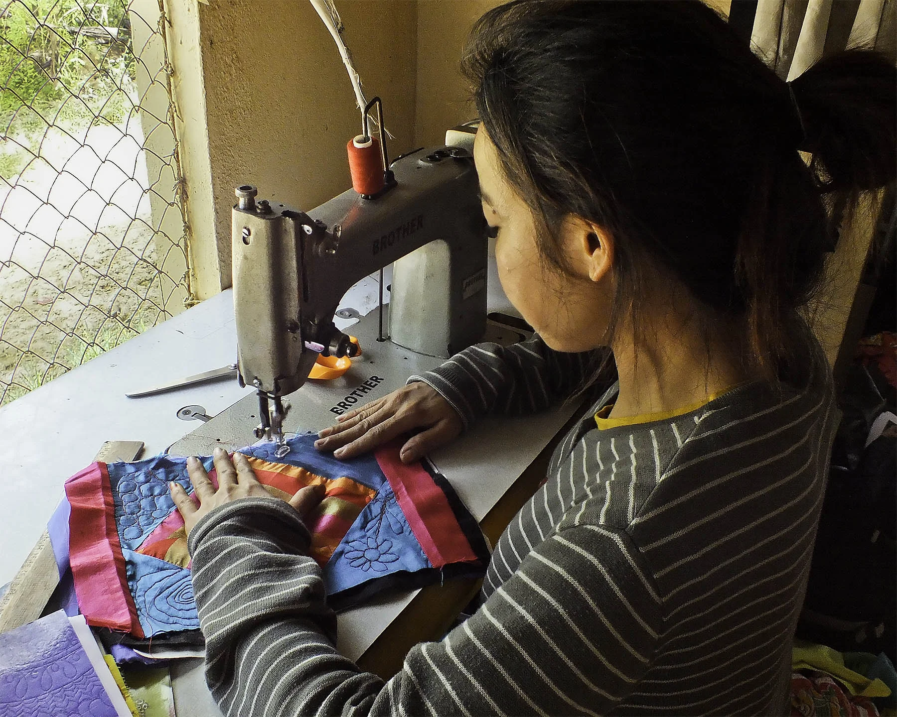 DSCF4940-woman at sewing machine-4x6[3762].jpg