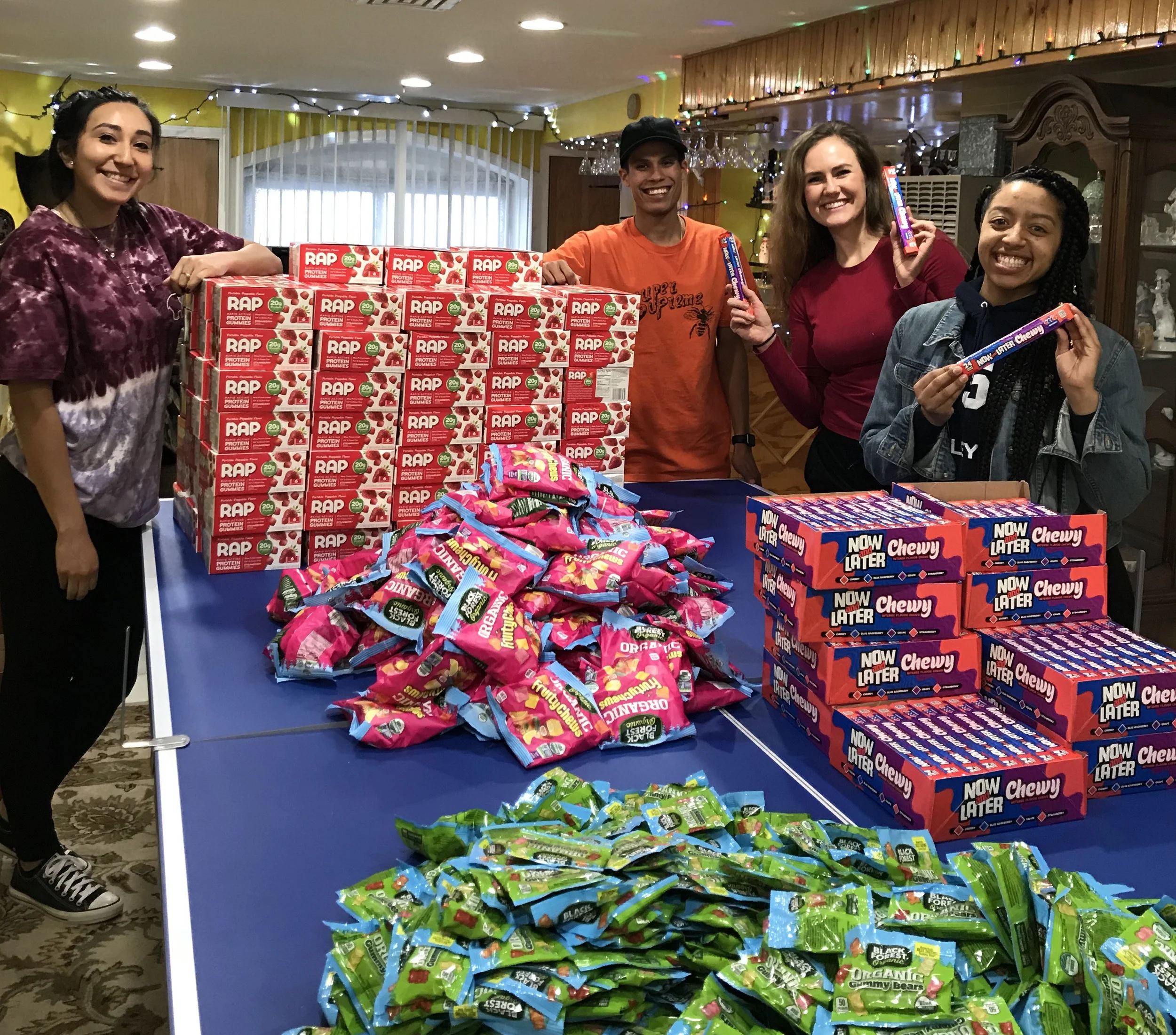 Karolina leads a crew in prepping bags full of treats to be included in care packages for those in need.