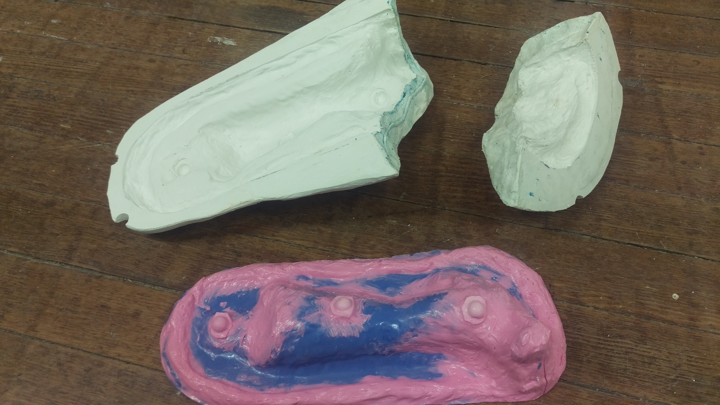  The brush on mold of the arm sculpt with a two part plaster mother mold. 