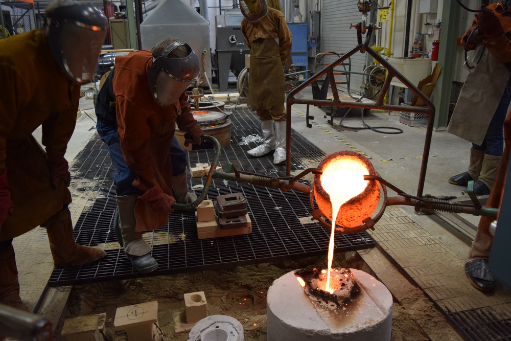  Pouring the first mold, which happens to be mine. This is the largest mold that I have done and it was very exciting to finally get metal into it. 