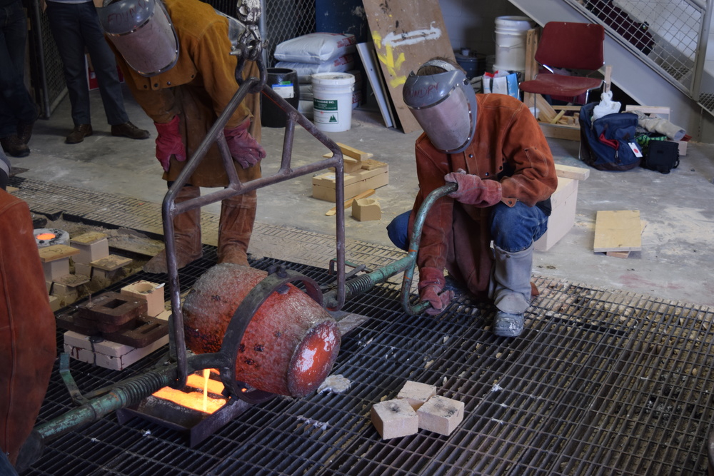  The remaining bronze is poured into ingots. About this time I was unbelievably hot. The heat radiating off the crucible and molten bronze is incredible to feel. 