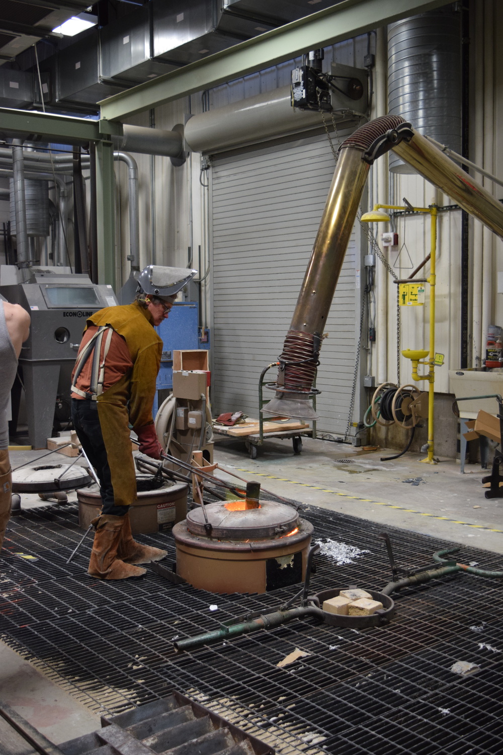  Sculptor and Art Metals instructor Peter Flanary loading the forge with bronze. Take a look at his work  HERE .   