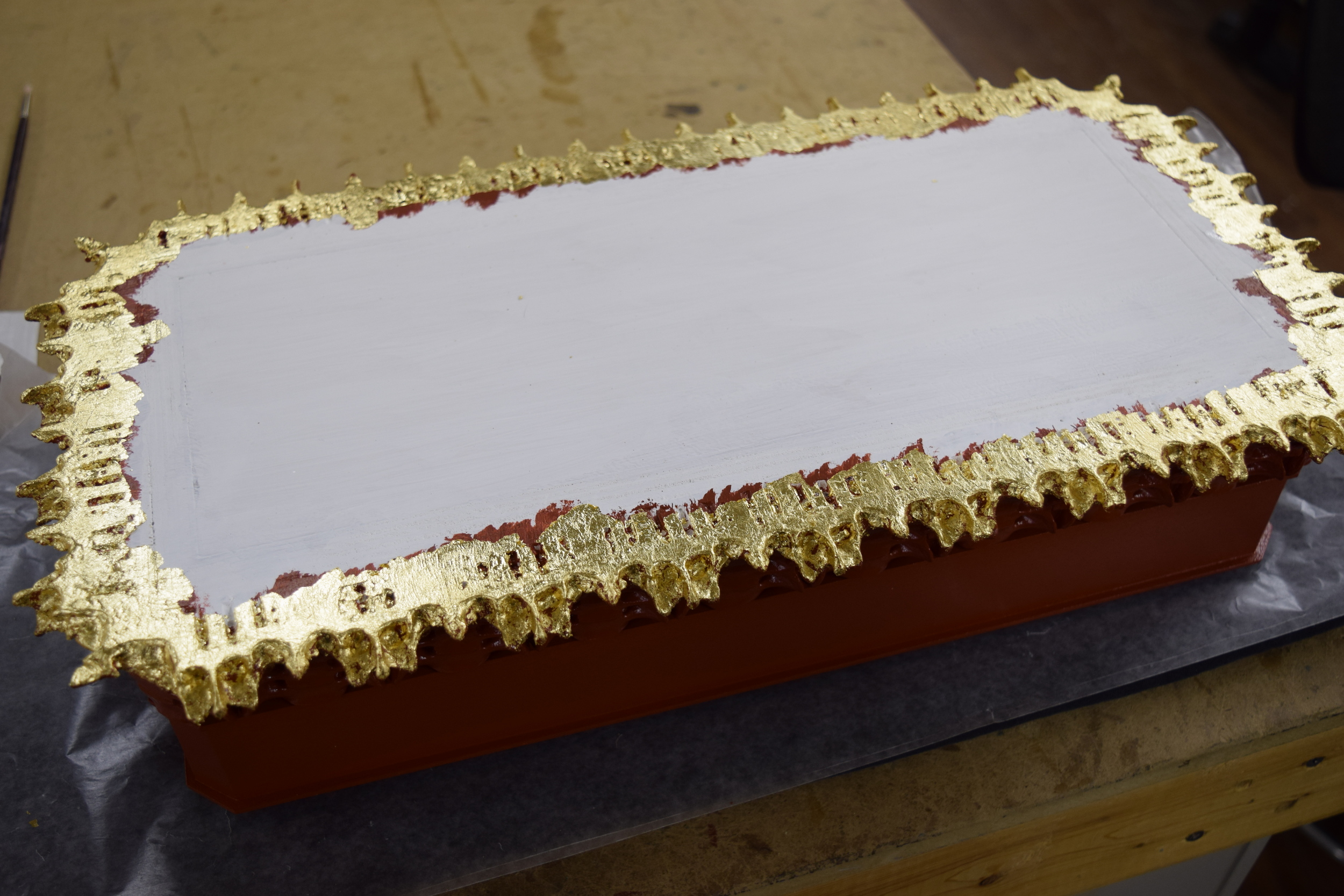  The finished gold leaf on the underside of the base. 