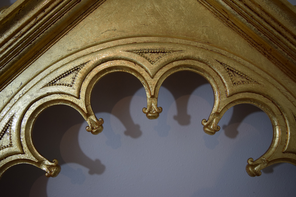  Detail of the top tracery of the frame's opening. 