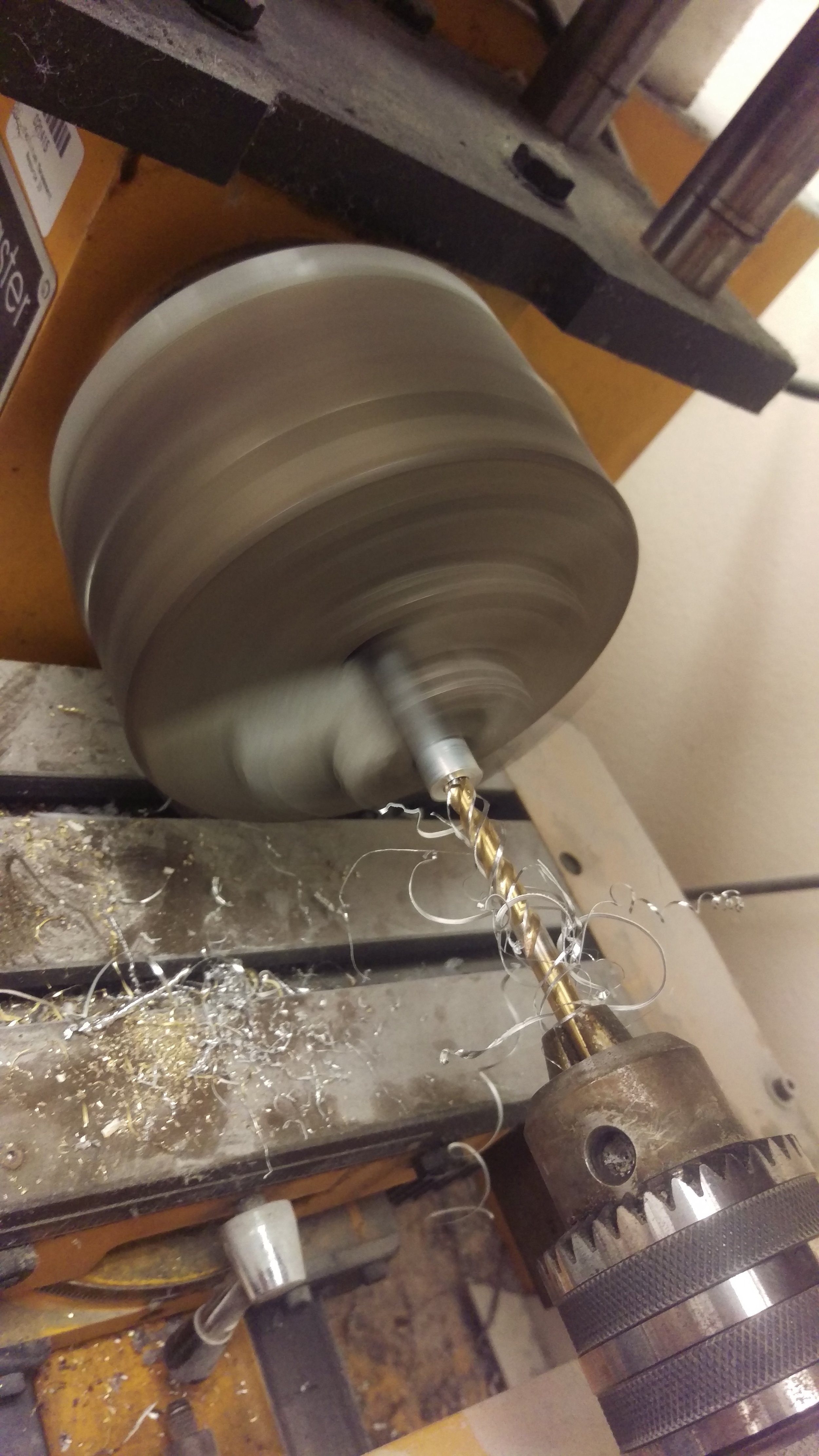  Using the metal lathe for the custom mechanisms. 