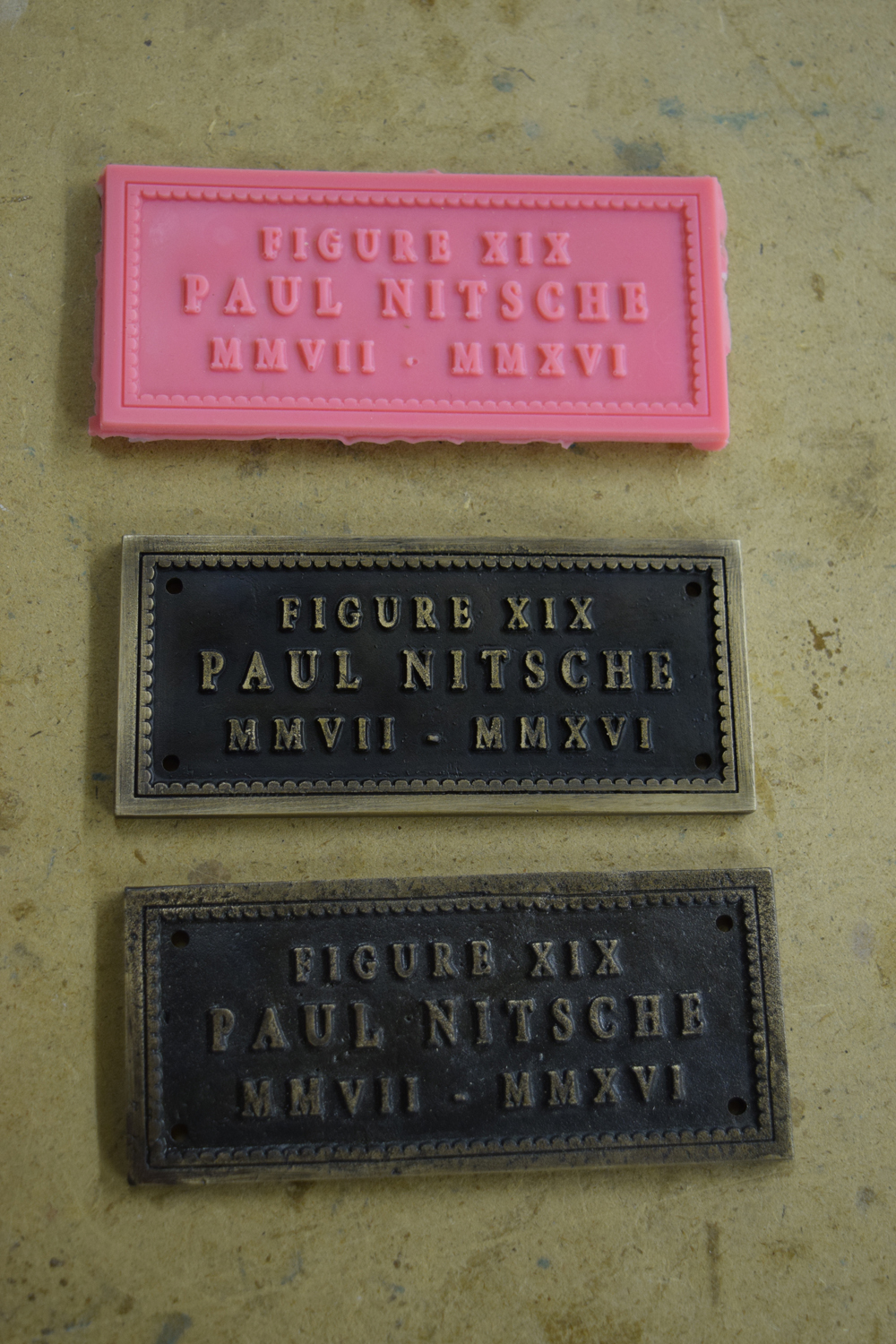  Comparison of the title plates. The original wax (top), the new title plate (middle), and the original title plate (bottom). 