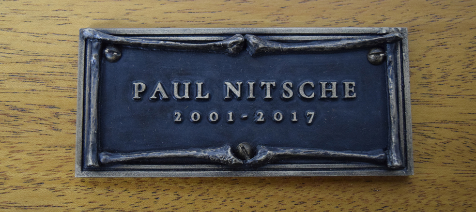  The finished bronze name plate with a liver of sulfur patina and clear coat. 