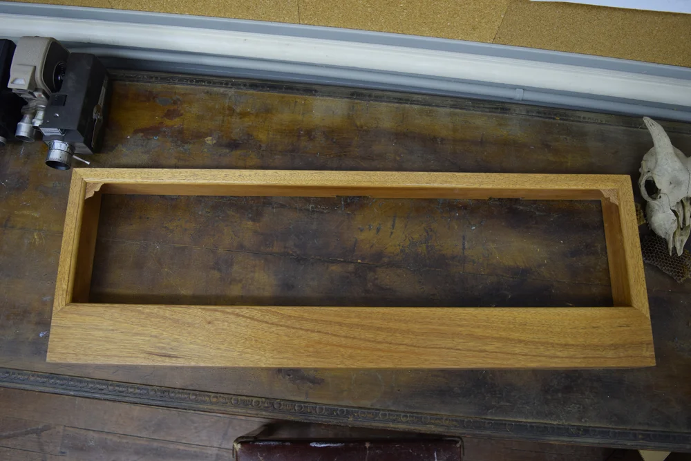  The finished mahogany shadowbox with sprayed clear coat. 