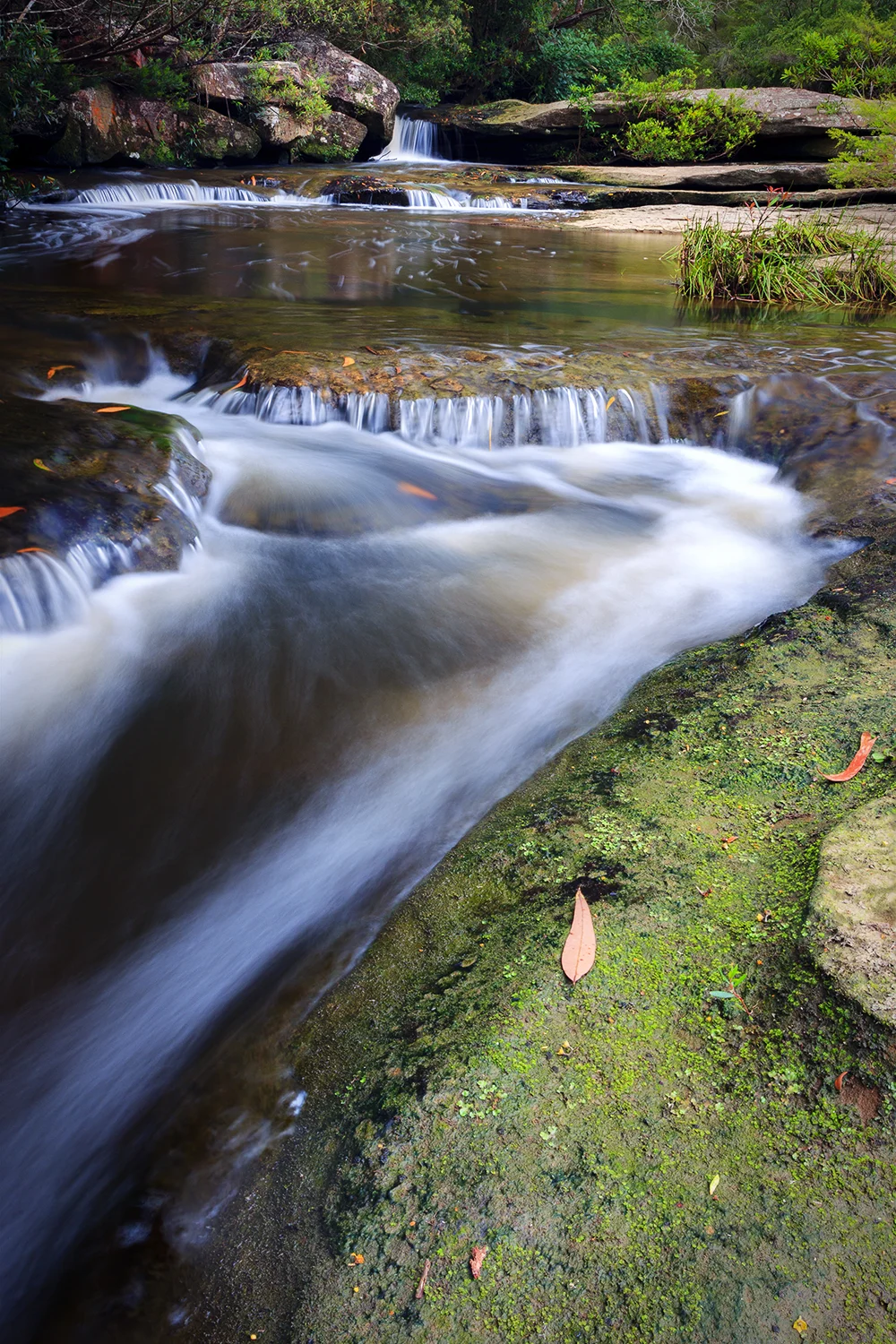 Multiple mini falls which cascade down to the main falls