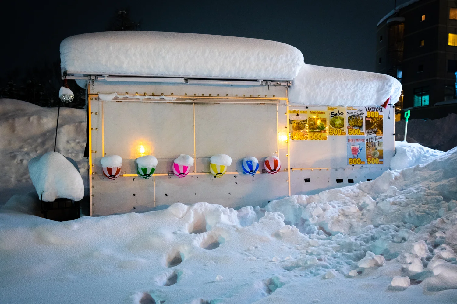 Snowed in food cart in the middle of town.