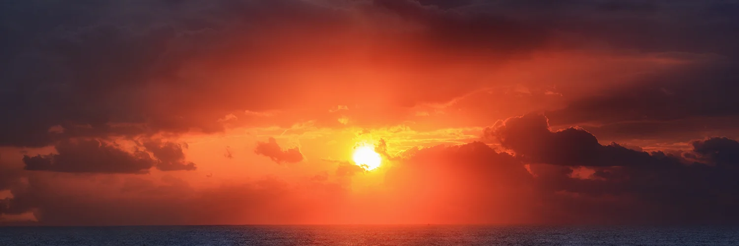 Sun rays bursting through the cloud.