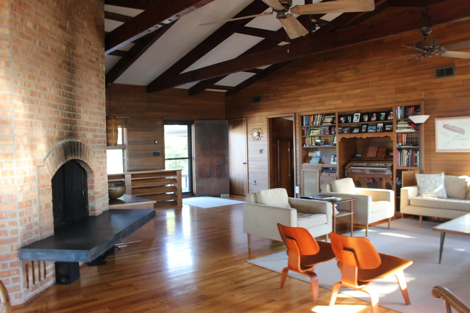 The Sebastian cottage has an open-concept floor plan. Note the built in shelving niche with the organ that James Sebastian often played.