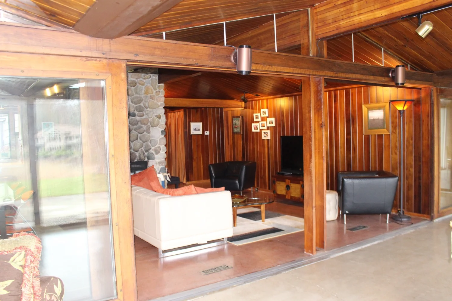 View of living room from front porch note extra large sliding glass door frames