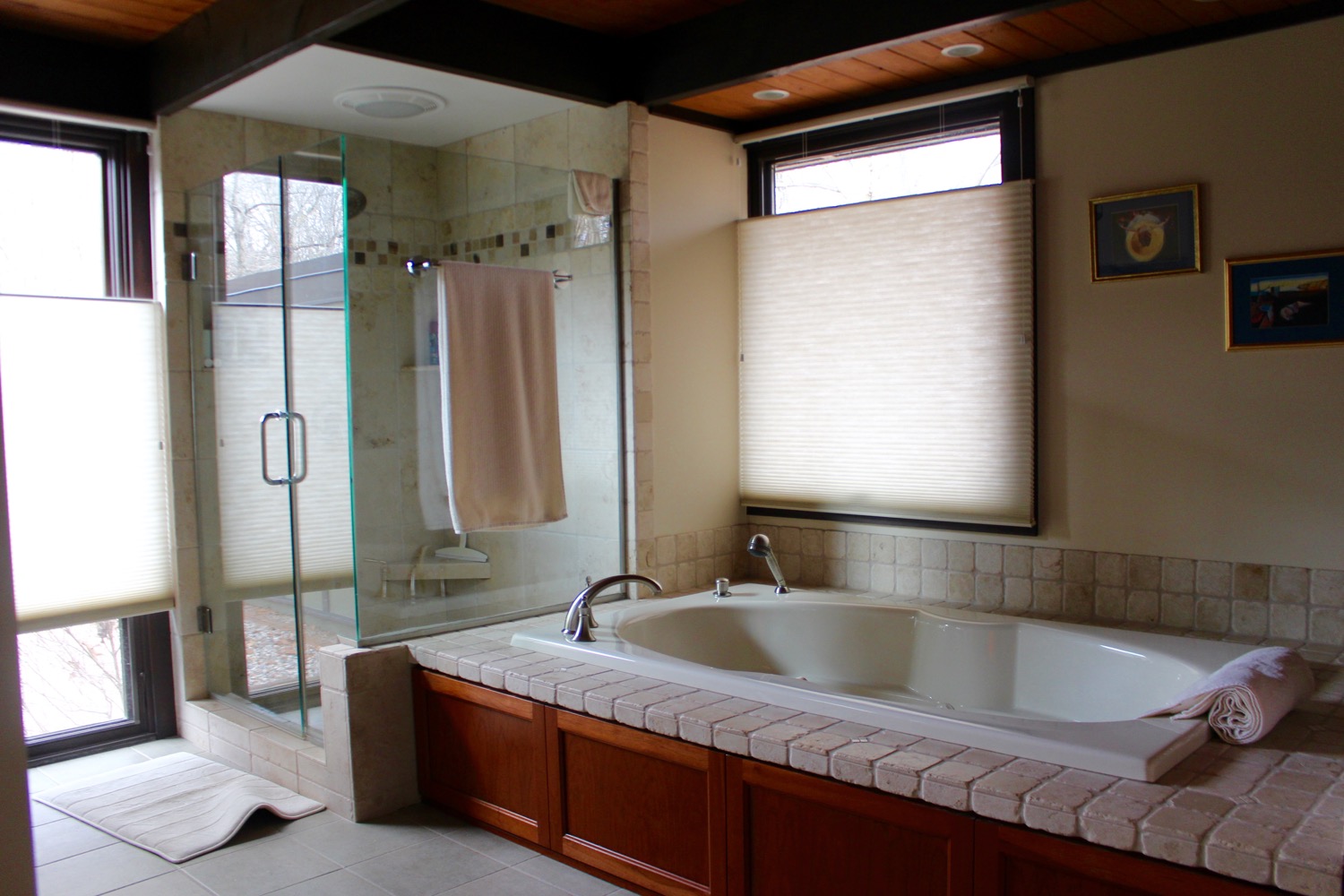 ENLARGED MASTER BATH WITH NEW 12 INCH FLOOR TILES, TILED SHOWER WITH GLASS WALLS, GARDEN TUB WITH TILE SURROUND