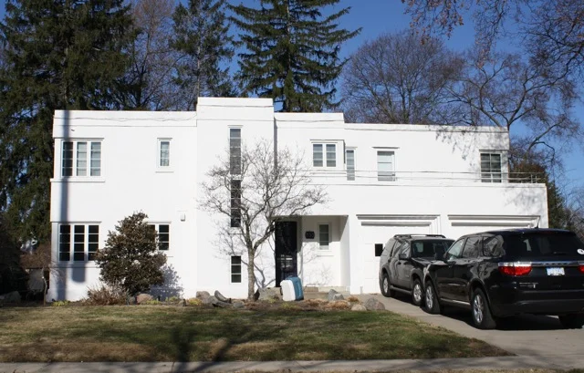 Distinctive design features include 3-story fireplace and nautical railing around second floor balcony