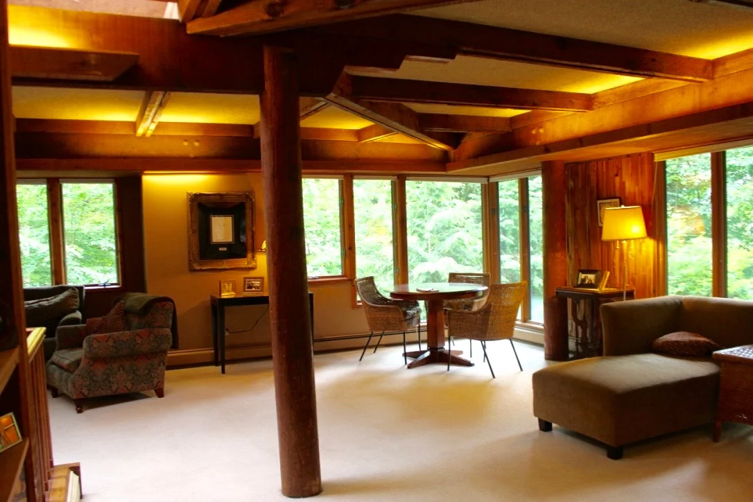 ANOTHER VIEW OF THE CEILING BEAMS WITH THE SOFT BUT DRAMATIC FLUORESCENT LIGHTING