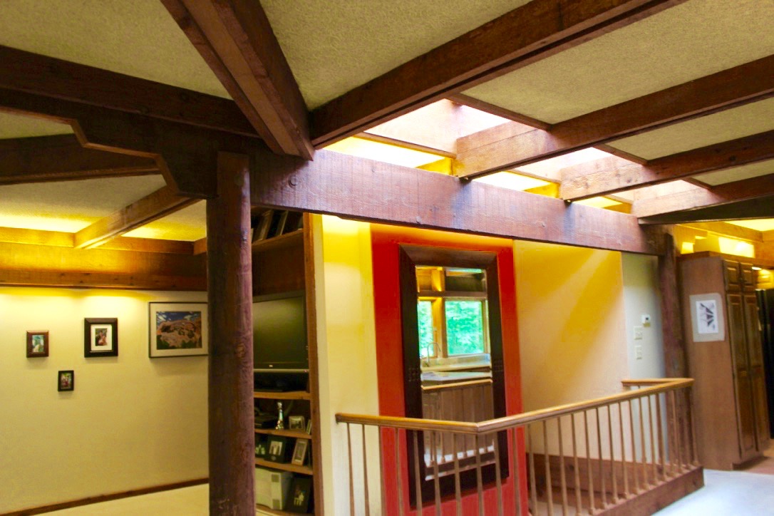 View of the stairway and central core of the house filled with light from the translucent skylight