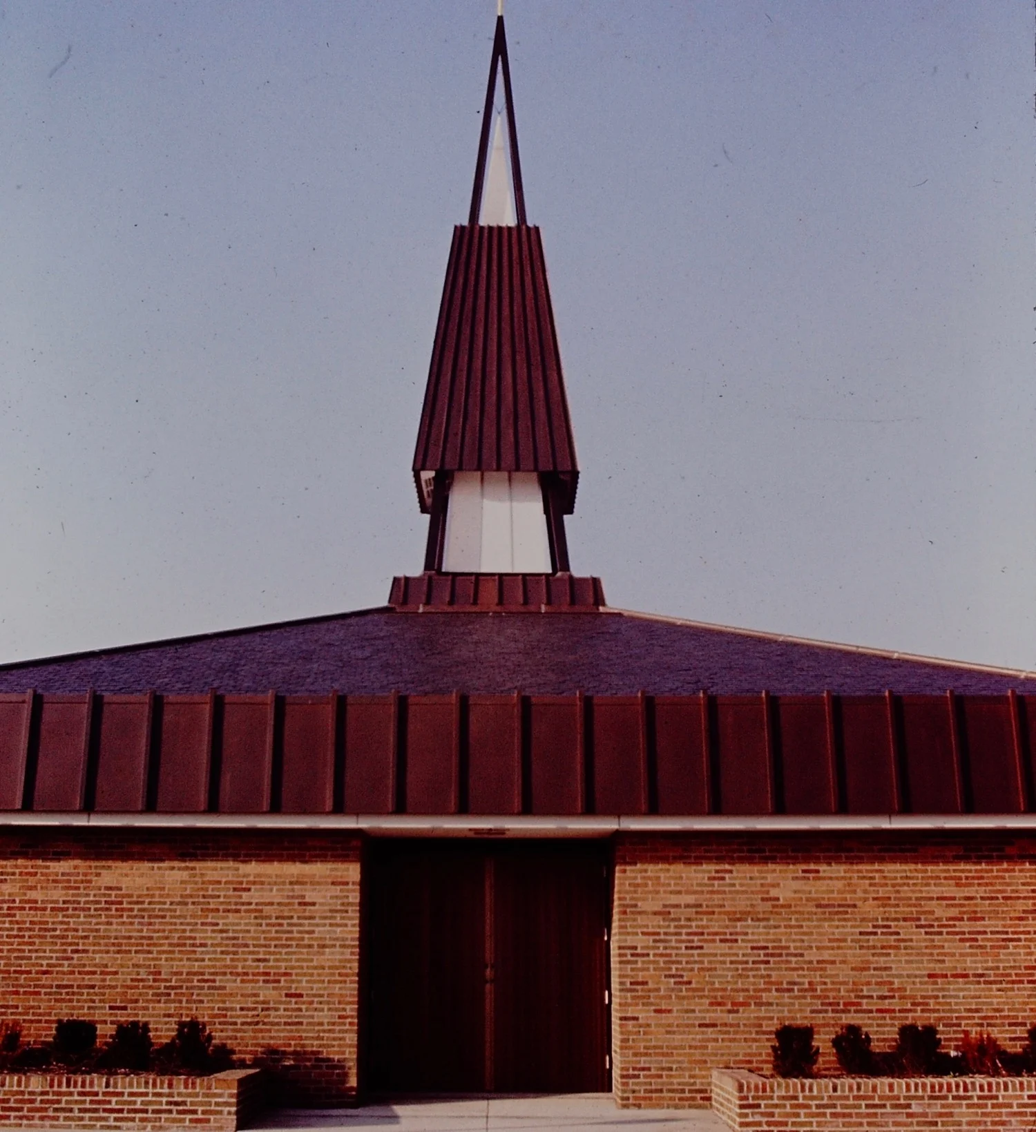 Holy Trinity Roman Catholic Church, exterior view with modern steeple designed by Firant. Photo from slide taken shortly after construction.