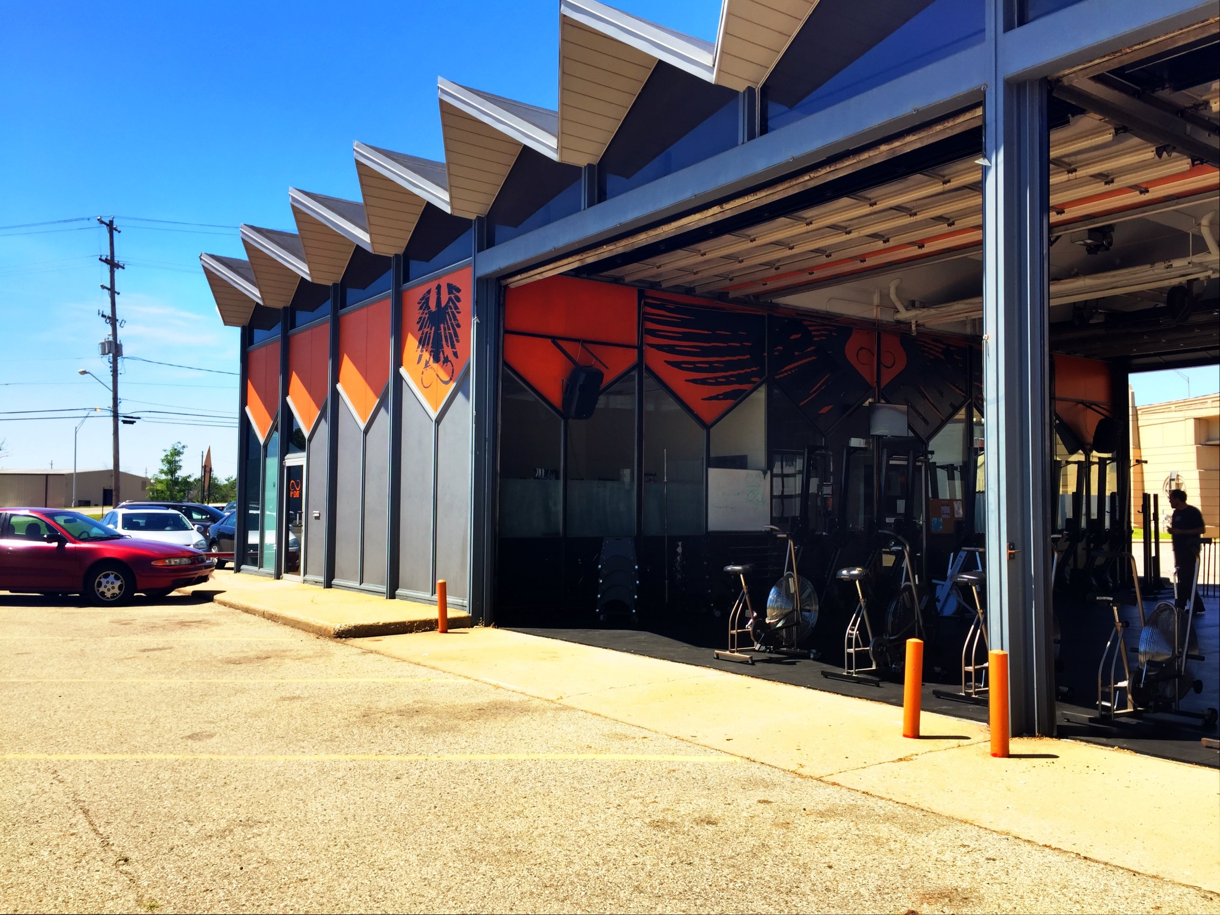 Those big garage doors seen in the vintage black and white photo are opened up here in this photo from July 2015. Photo by Pam VanderPloeg copyright 2015.