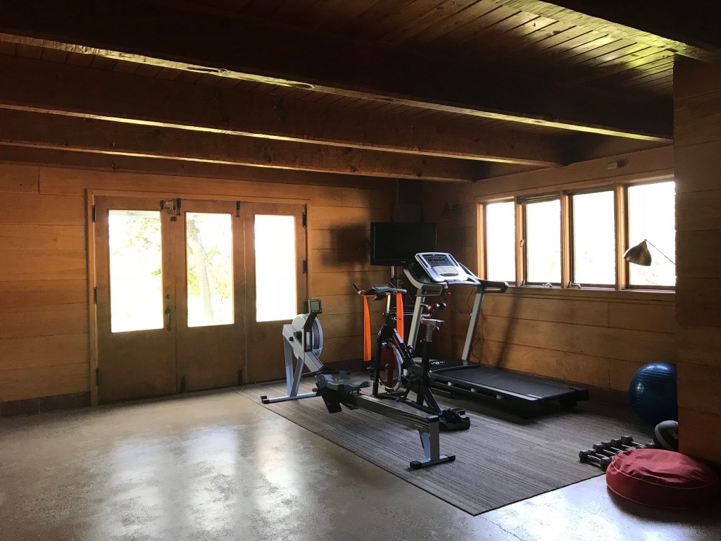 GYM IN CONVERTED SPECIALTY CAR GARAGE IN WALKOUT BASEMENT