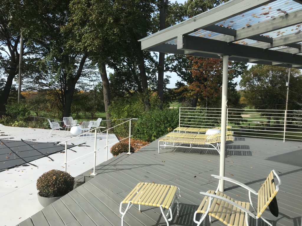 DECK AND PERGOLA OVERLOOKING POOL