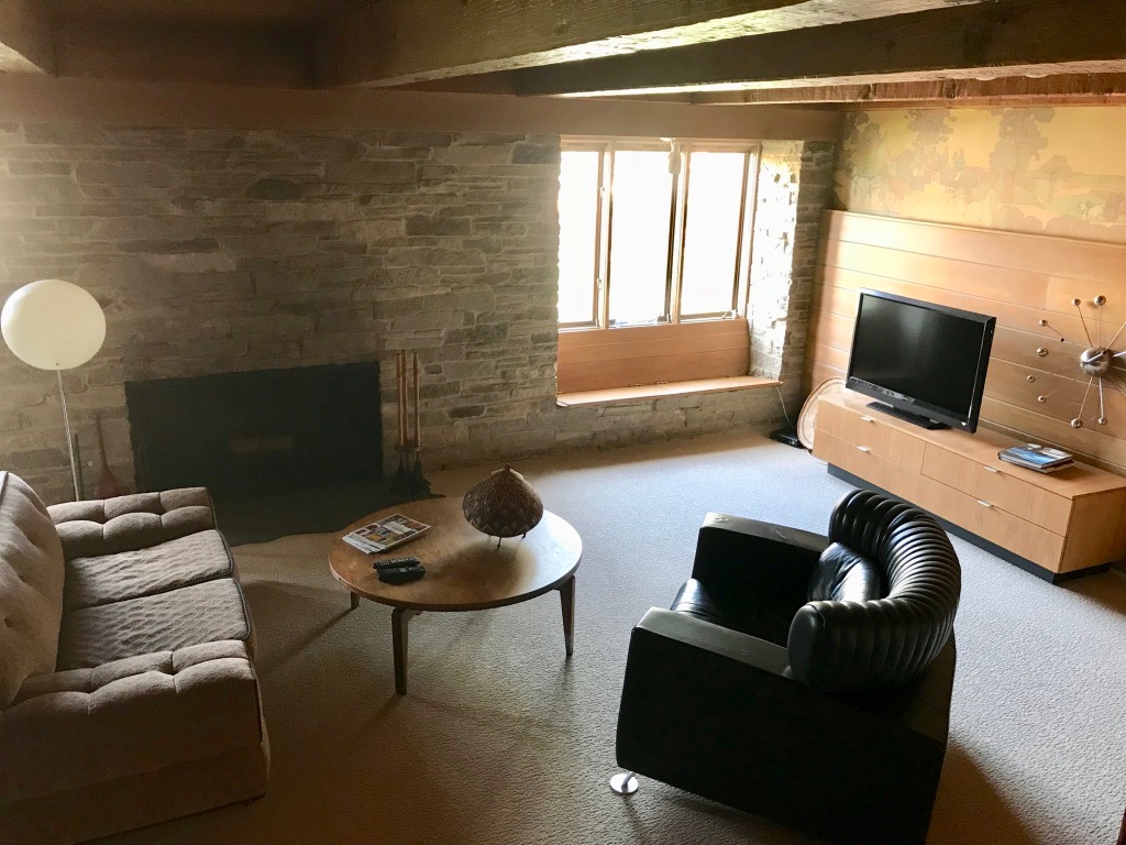 STONE FIREPLACE AND MURAL WALL PAPER