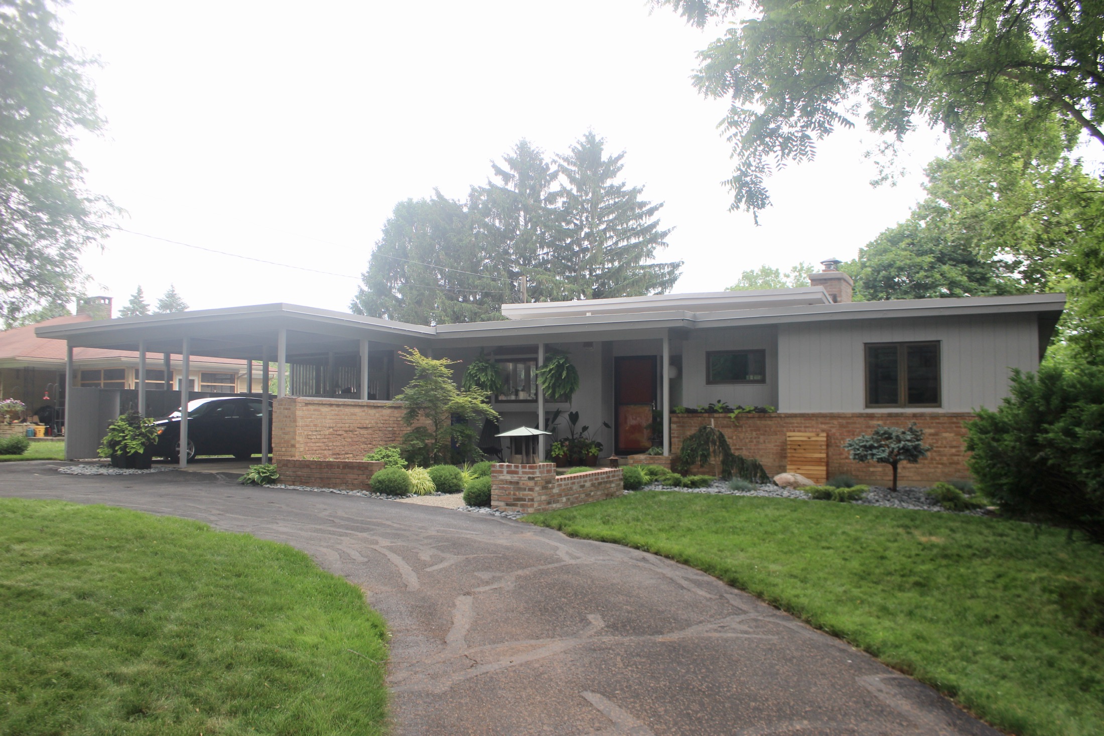 Exterior with view of carport and circular drive