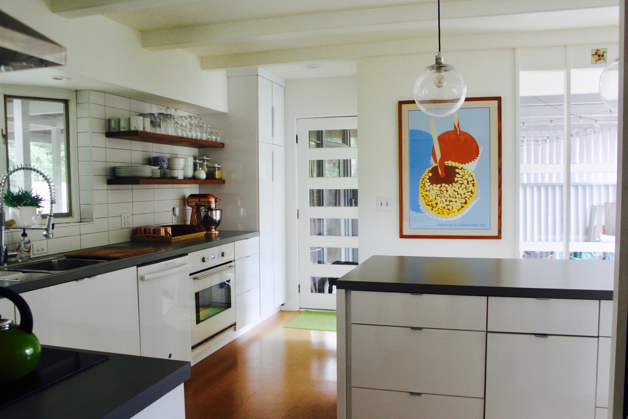 BURNISHED CORK FLOORS, STYLISH DOOR WITH LIGHTS AND NEWER KITCHEN ADDED BY PREVIOUS OWNERS