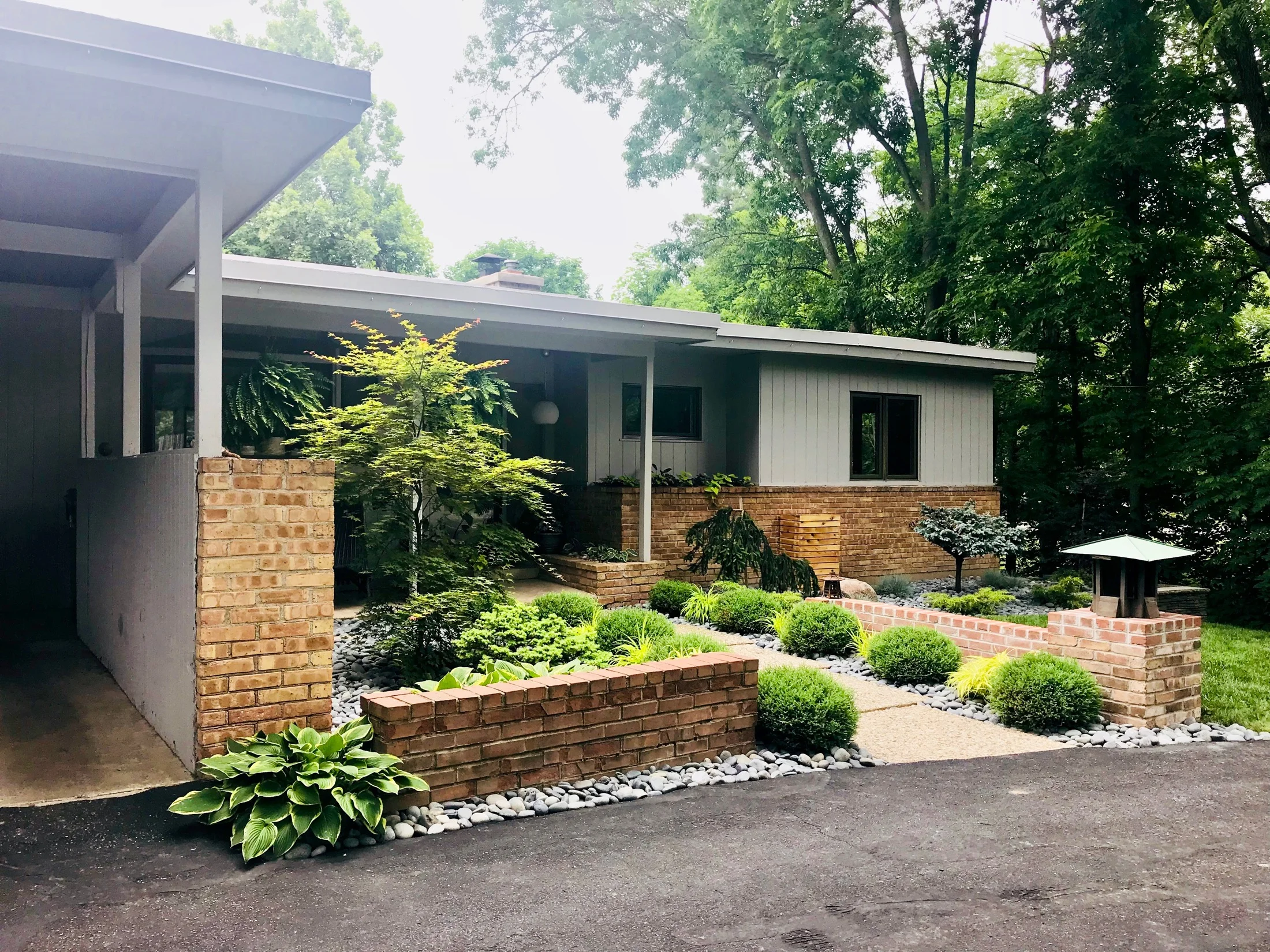 Front exterior showing the new garden plantings created by Beth who has a talent for landscape architecture.